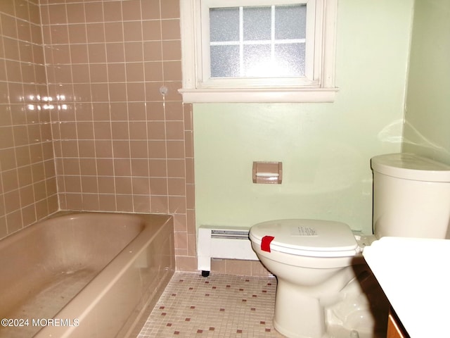 bathroom featuring tile patterned floors, vanity, toilet, and baseboard heating