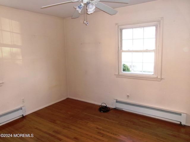 spare room with ceiling fan, dark hardwood / wood-style flooring, and a baseboard radiator