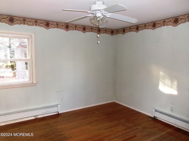 spare room with ceiling fan, dark hardwood / wood-style flooring, and a baseboard radiator