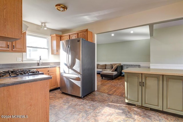 kitchen featuring sink, appliances with stainless steel finishes, and green cabinetry