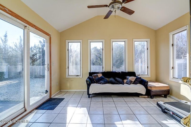 sunroom / solarium featuring ceiling fan, plenty of natural light, and vaulted ceiling