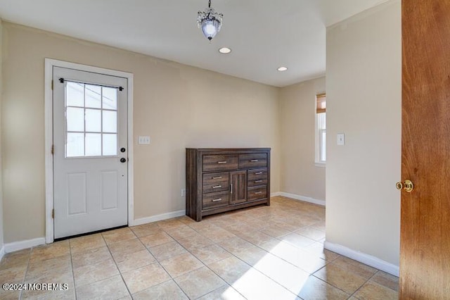 entrance foyer with a wealth of natural light and light tile patterned floors