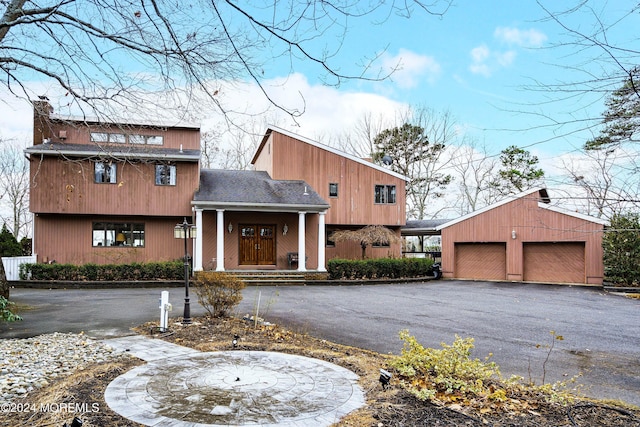 view of front of home featuring an outbuilding and a garage