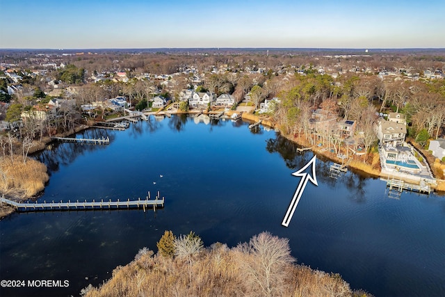 birds eye view of property featuring a water view