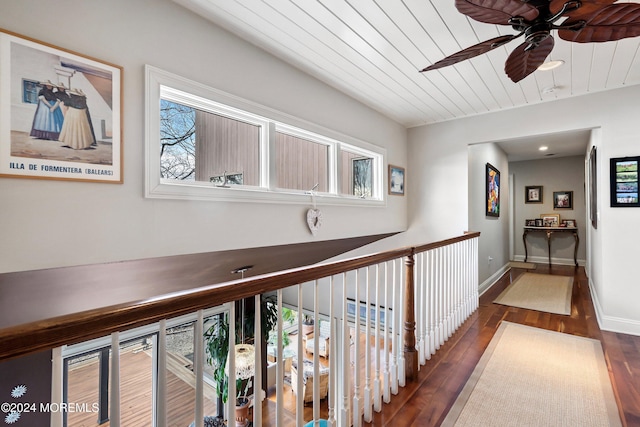 hallway featuring dark hardwood / wood-style flooring and wood ceiling