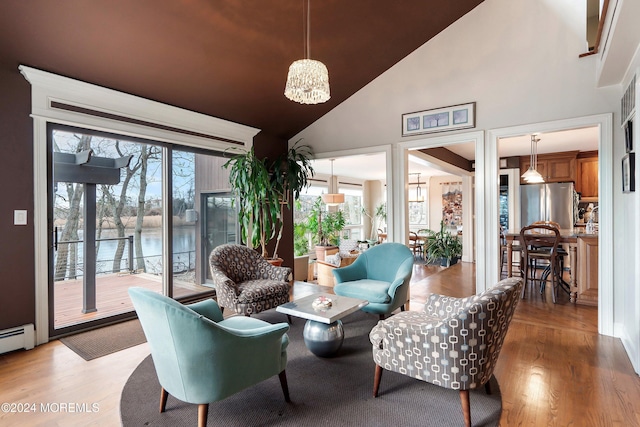 interior space featuring a water view, a chandelier, and vaulted ceiling