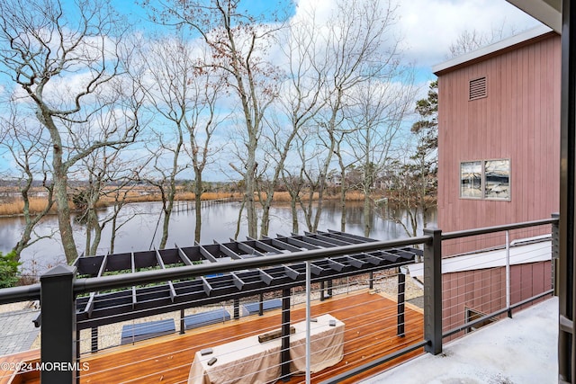 view of dock with a water view and a balcony