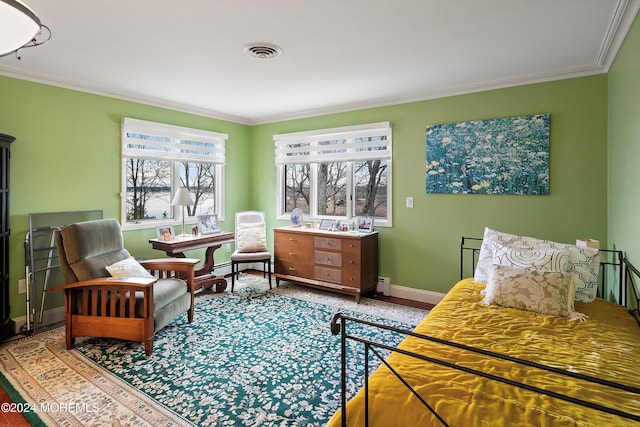 sitting room featuring baseboard heating and crown molding