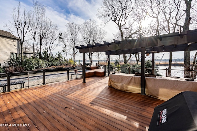 wooden deck with a water view