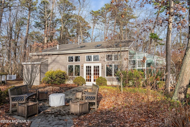 rear view of property with a patio area and french doors