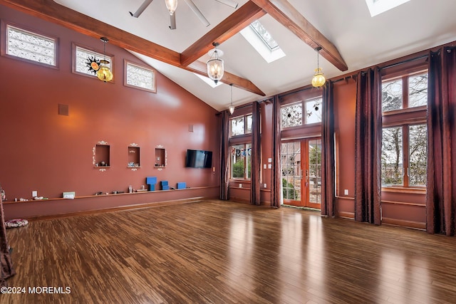 interior space with a wealth of natural light, wood-type flooring, and high vaulted ceiling