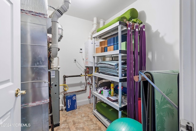 storage room featuring water heater