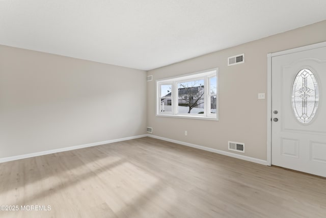 foyer with light wood-type flooring