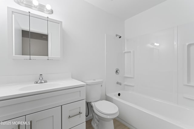 full bathroom with vanity, shower / bathtub combination, and toilet