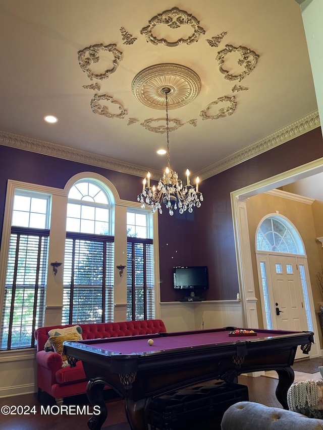 playroom featuring a healthy amount of sunlight, crown molding, billiards, and an inviting chandelier