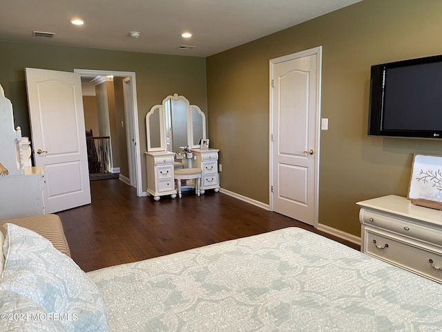 bedroom featuring dark hardwood / wood-style flooring