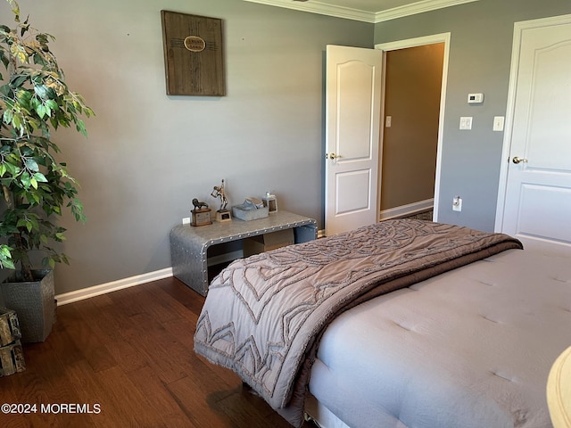 bedroom featuring dark hardwood / wood-style floors and ornamental molding