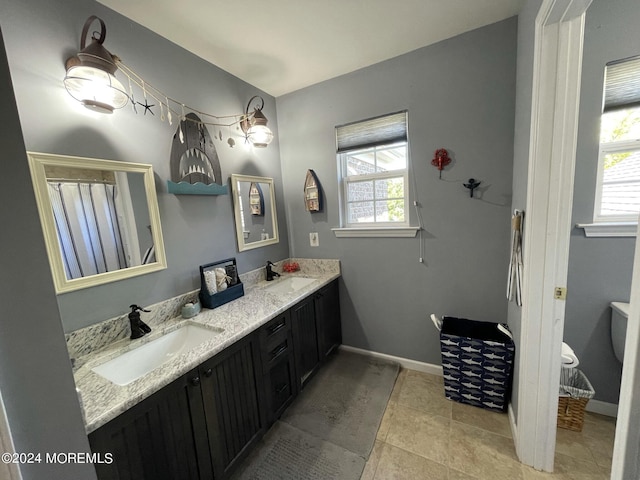 bathroom with tile patterned flooring and vanity