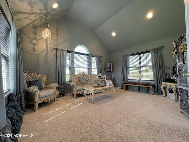 living area featuring carpet flooring and high vaulted ceiling