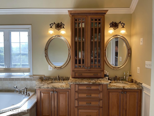 bathroom featuring vanity, tiled bath, and crown molding