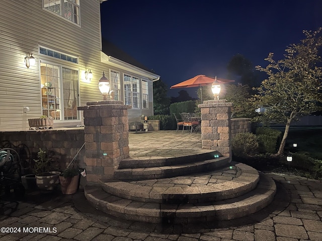 view of patio at twilight