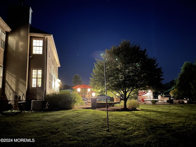 yard at night with central AC