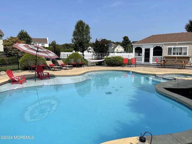 view of swimming pool with a patio area