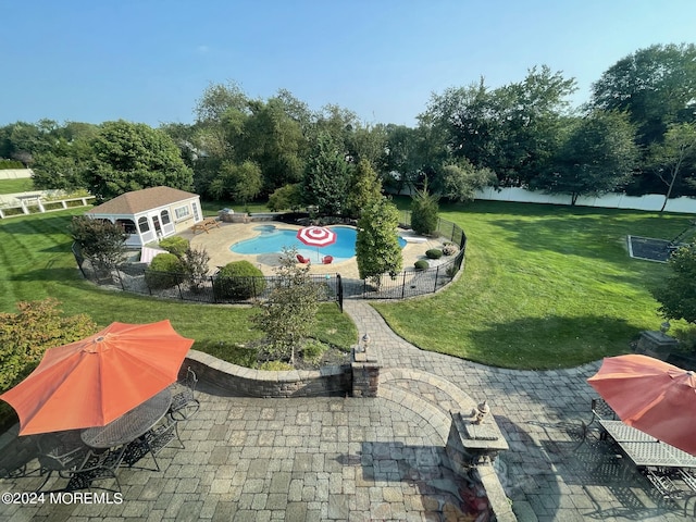 view of home's community featuring a patio, a lawn, and a swimming pool