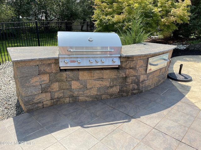 view of patio featuring area for grilling and grilling area