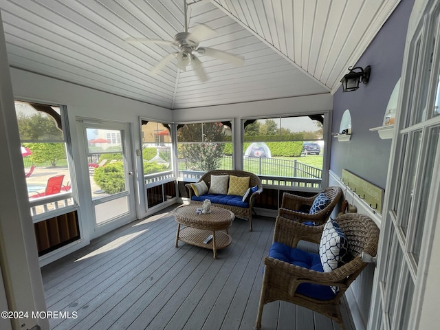 sunroom / solarium featuring ceiling fan, wooden ceiling, and vaulted ceiling