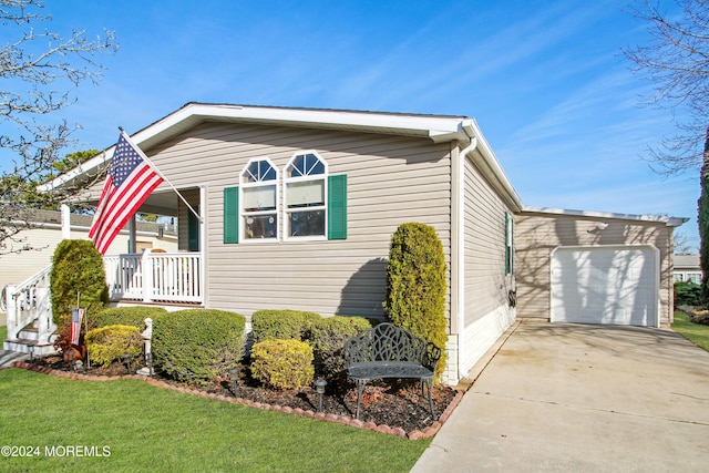 view of front of home with a porch and a garage