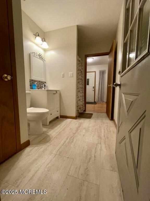 bathroom featuring vanity and toilet