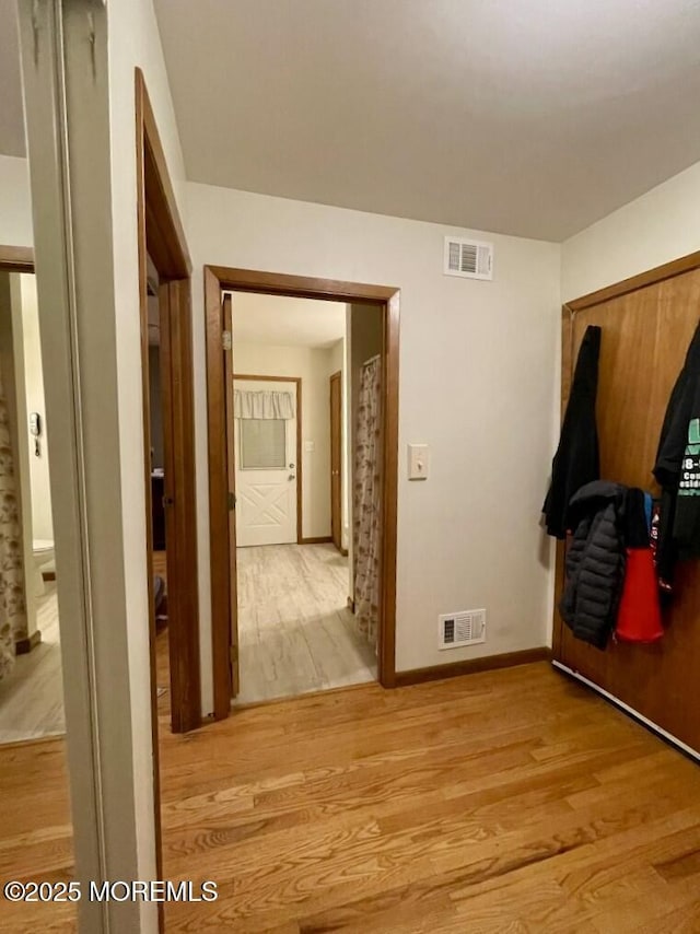 mudroom with light hardwood / wood-style flooring