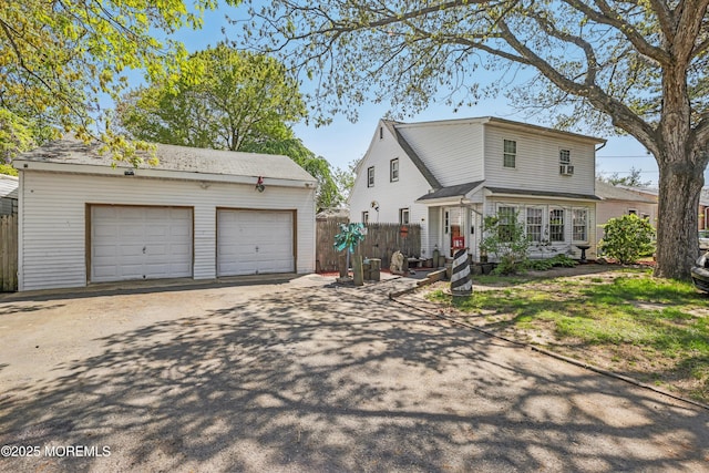 2213 2nd Ave, Toms River, NJ 08753 - traditional-style home with an outdoor structure, fence, and a garage