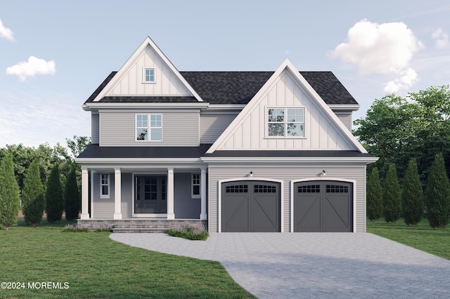 view of front of house featuring board and batten siding, a front yard, decorative driveway, and a garage