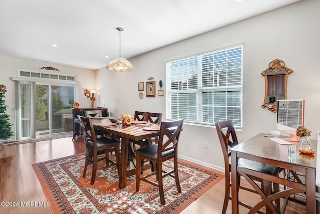 dining room with light hardwood / wood-style flooring and plenty of natural light