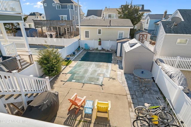 exterior space with a patio and a shed