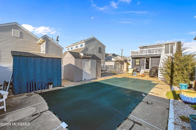 exterior space featuring a patio and a shed