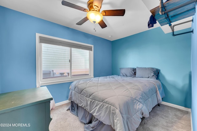 bedroom featuring light colored carpet and ceiling fan