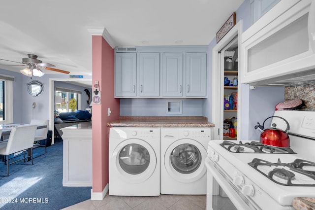 laundry area with washing machine and dryer, ceiling fan, and light tile patterned floors