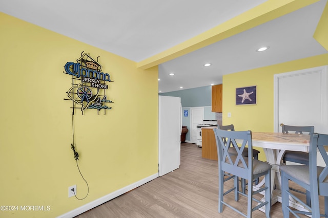 dining space with light wood-type flooring