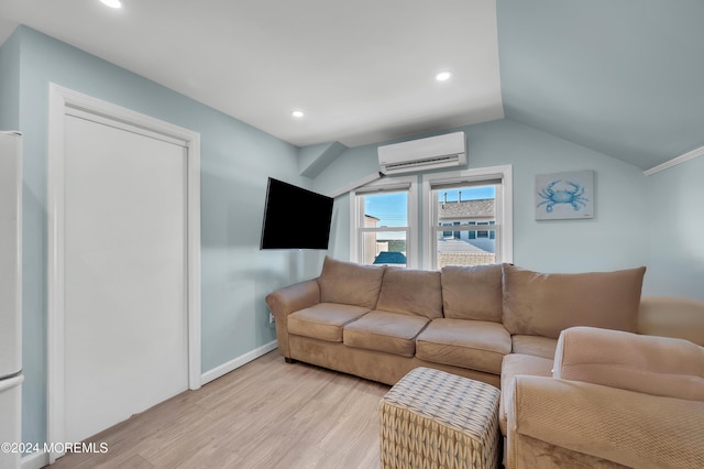 living room with a wall mounted air conditioner, light hardwood / wood-style floors, and vaulted ceiling