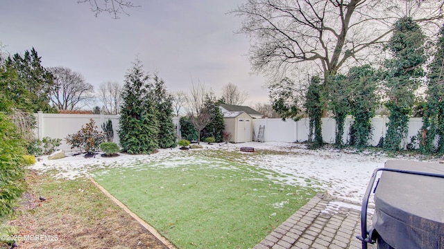 view of yard featuring a shed and an outdoor fire pit