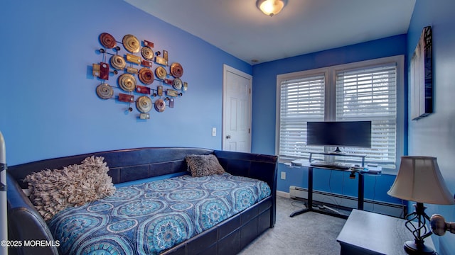 carpeted bedroom featuring a baseboard radiator