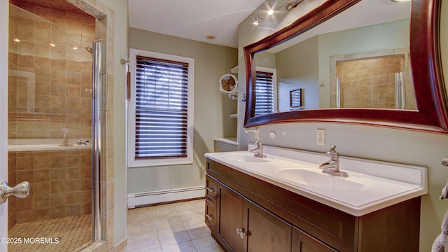 bathroom featuring baseboard heating, tile patterned floors, vanity, and a shower with shower door