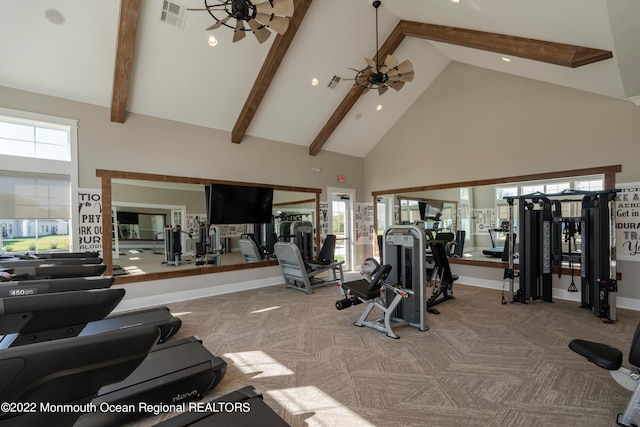 gym featuring ceiling fan, high vaulted ceiling, and light carpet