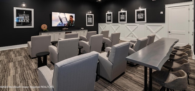 home theater room featuring dark hardwood / wood-style floors