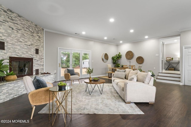 living room featuring a fireplace, dark wood-type flooring, and ornamental molding