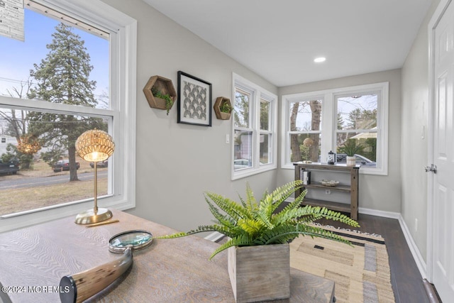 sunroom / solarium featuring a healthy amount of sunlight