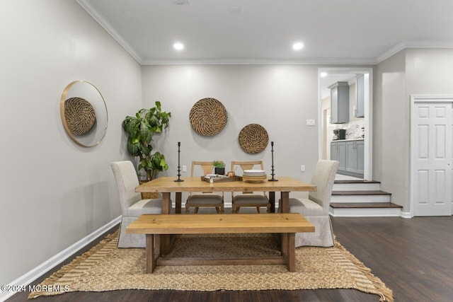 dining space featuring dark hardwood / wood-style floors and ornamental molding